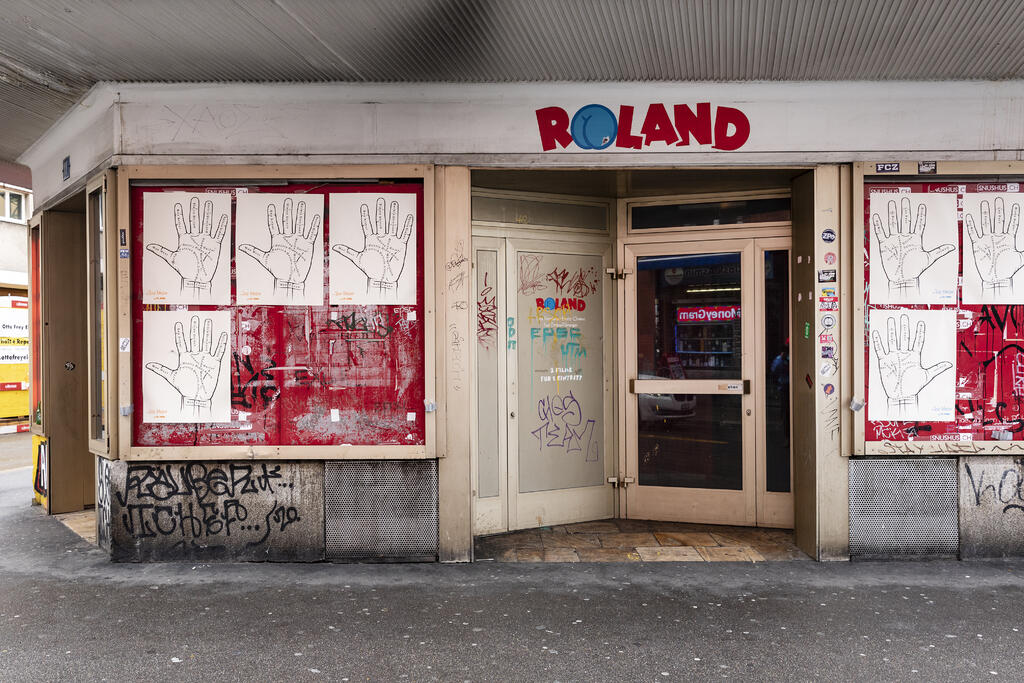 Outside view of Kino Roland, prints in the showcases by Larry Johnson, <i>Untitled (L+R)</i>, 2020.